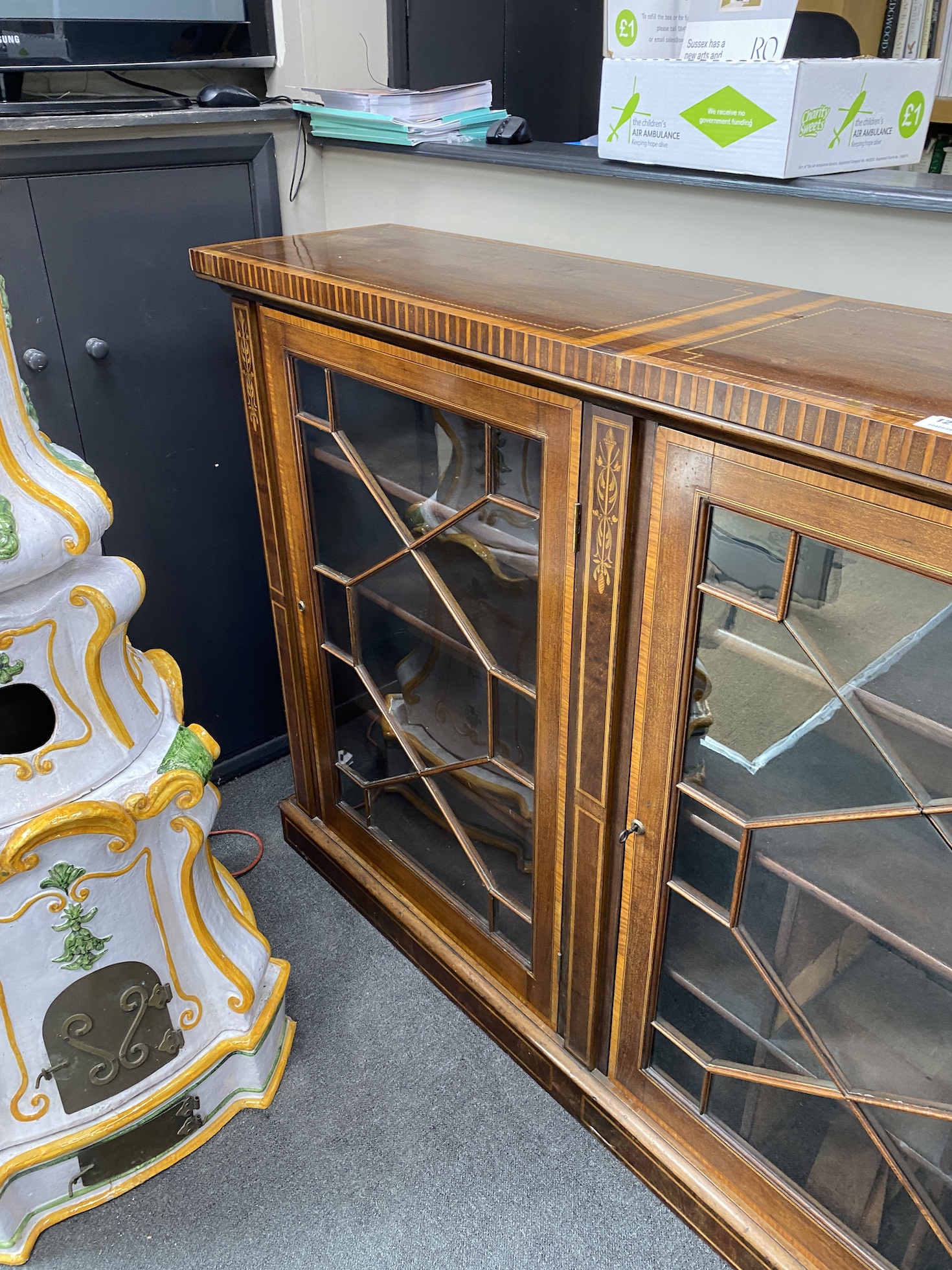 An Edwardian marquetry inlaid satinwood banded dwarf bookcase, width 259cm, depth 41cm, height 127cm